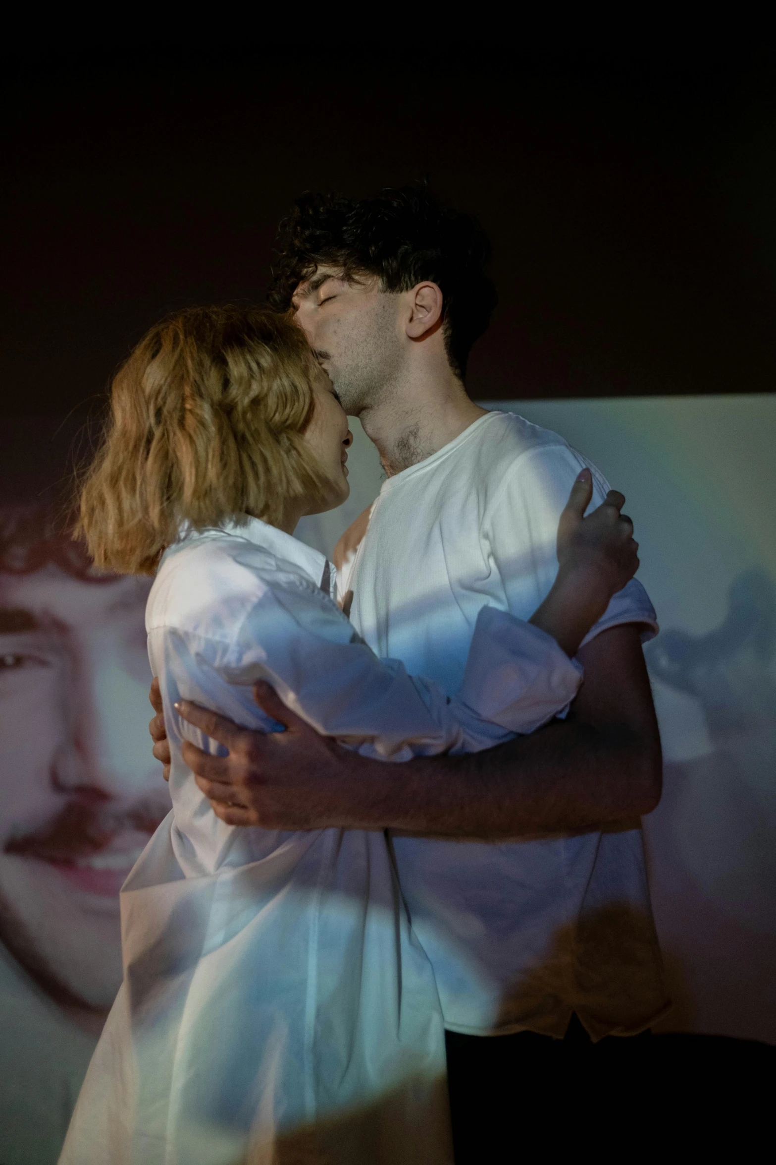 a couple of people that are hugging each other, a portrait, inspired by Nan Goldin, unsplash, 3 actors on stage, mark edward fischbach, performance, ( ( theatrical ) )