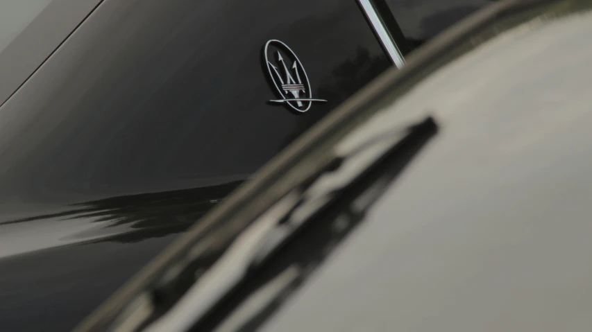 a close up of a car with a logo on it, unsplash, mercury, pininfarina, taken in the late 2010s, low iso