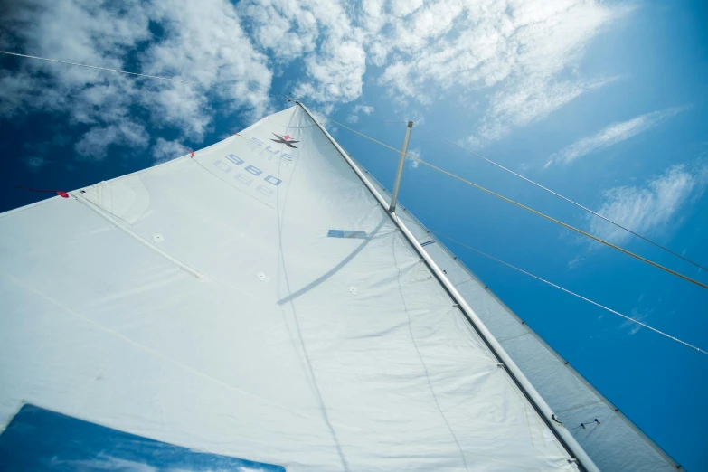 a white sail boat with a blue sky in the background, unsplash, figuration libre, overhead canopy, 45 degrees from the side, axure sky, ultra-detailed