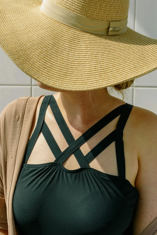 a close up of a person wearing a hat, inspired by Sun Long, renaissance, wearing two - piece swimsuit, award - winning crisp details, deep black, deep green