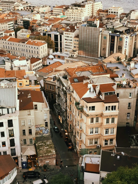 a view of a city from the top of a building, houses and buildings, 1 petapixel image, brown, split near the left