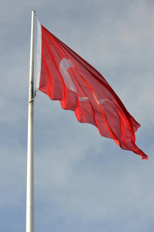 a red and white flag flying in the wind, by David Simpson, hurufiyya, istanbul, tungsten, square, big sky