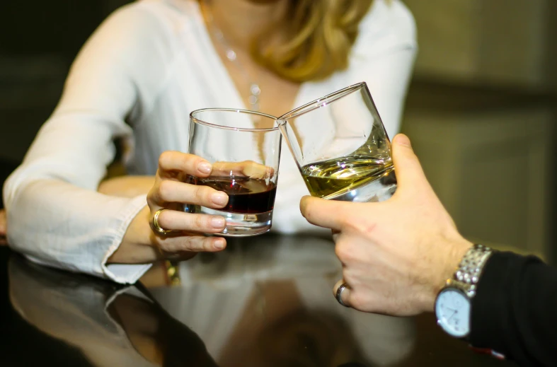 a man and a woman holding glasses of wine, by Niko Henrichon, pexels, drinking a glass of whiskey, four hands, thumbnail, absinthe