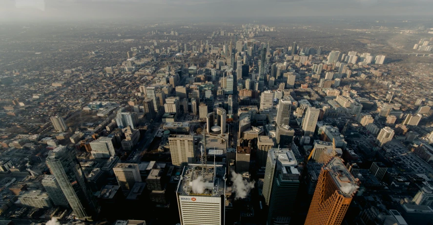 an aerial view of a city with tall buildings, by Andrew Domachowski, pexels contest winner, hurufiyya, toronto, slide show, group photo, close establishing shot