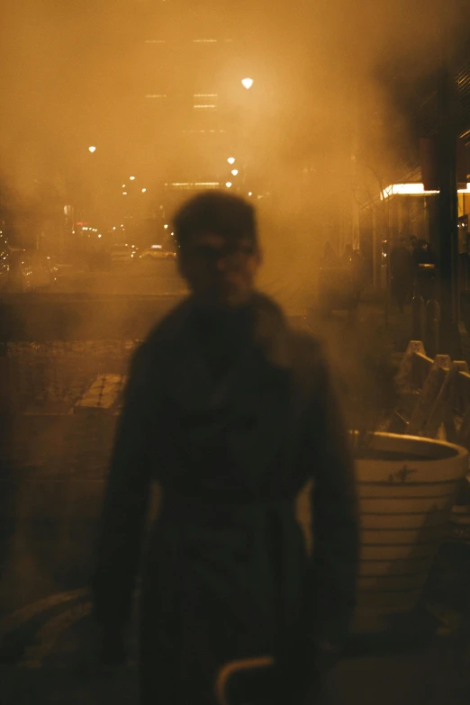 a man walking down a street at night, inspired by roger deakins, very smoky paris bar, sandstorm, film still from'doctor strange', ( ( theatrical ) )