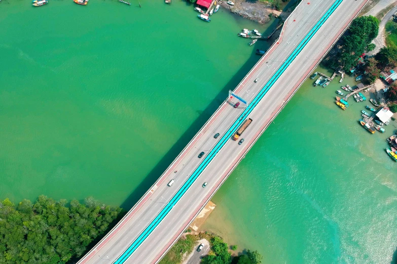 an aerial view of a bridge over a body of water, pexels contest winner, hurufiyya, floating. greenish blue, kuala lumpur, highway, thumbnail