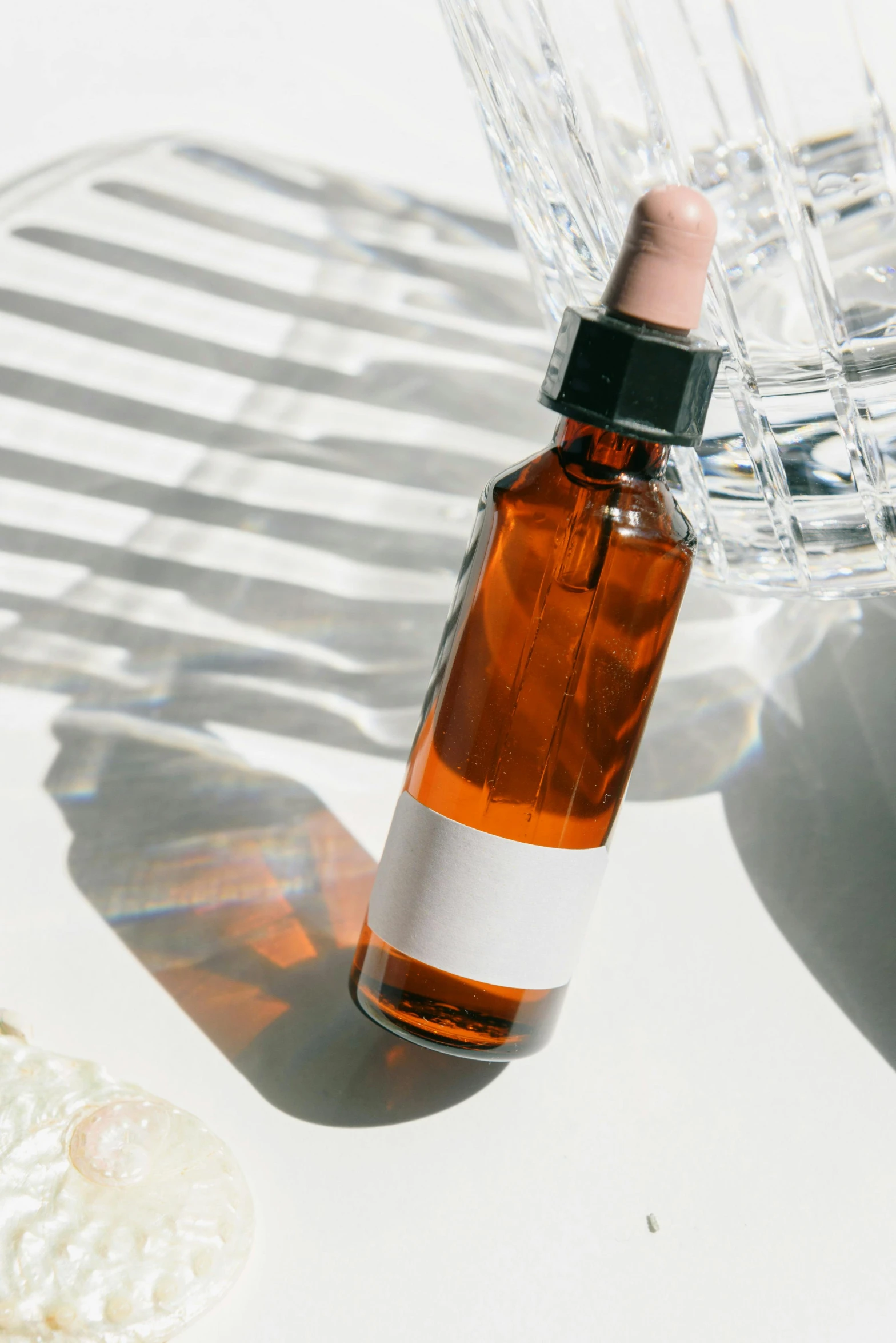 a bottle of liquid sitting on top of a table, by Carey Morris, unsplash, renaissance, skincare, amber, profile image, on clear background