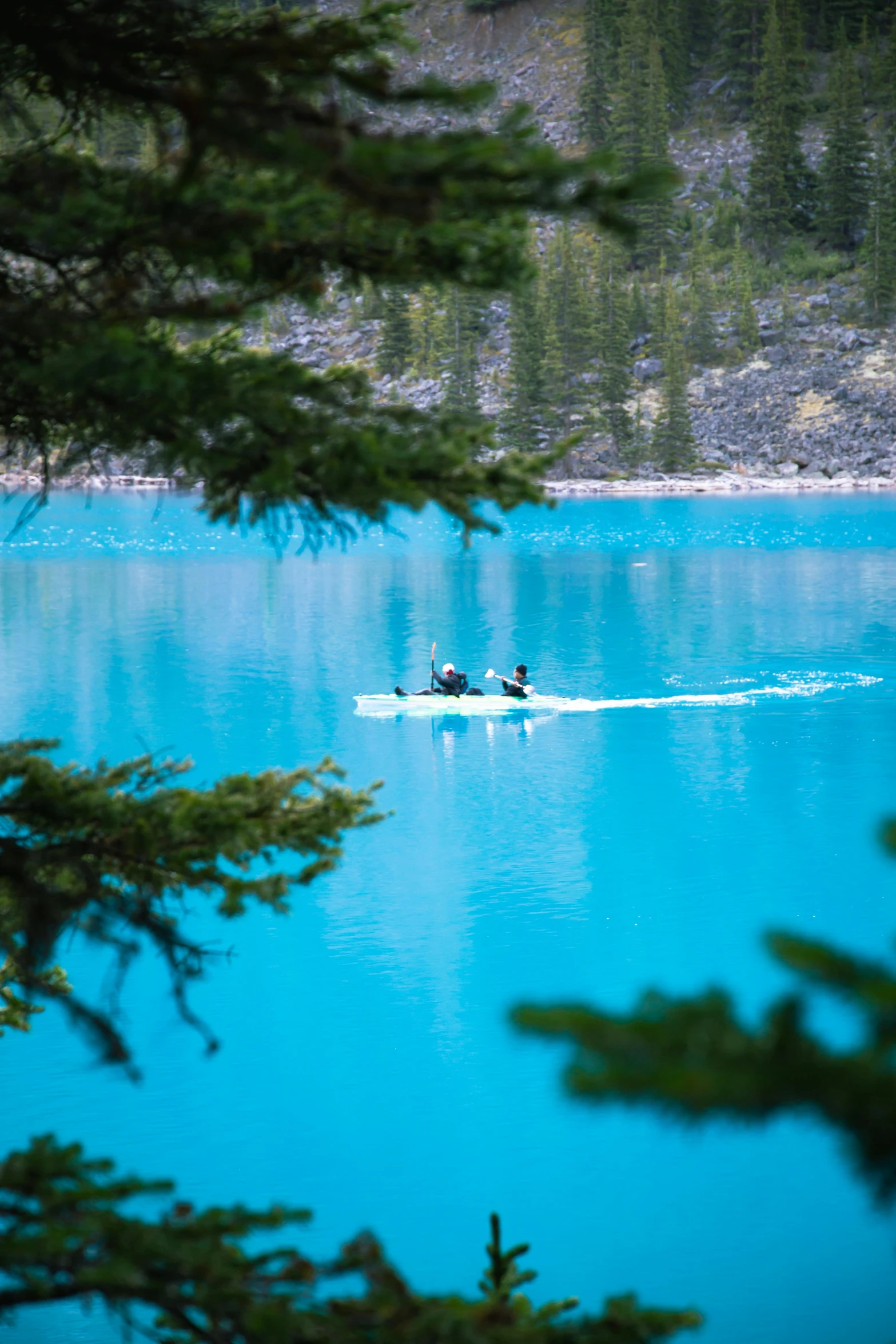 a couple of people in a boat on a lake, banff national park, cerulean blue, slide show, victoria siemer