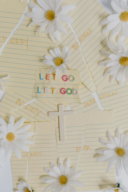 a bunch of white flowers sitting on top of a piece of paper, inspired by Jesús Mari Lazkano, trending on pexels, then leave it to god, gogo : :, light yellow, letters