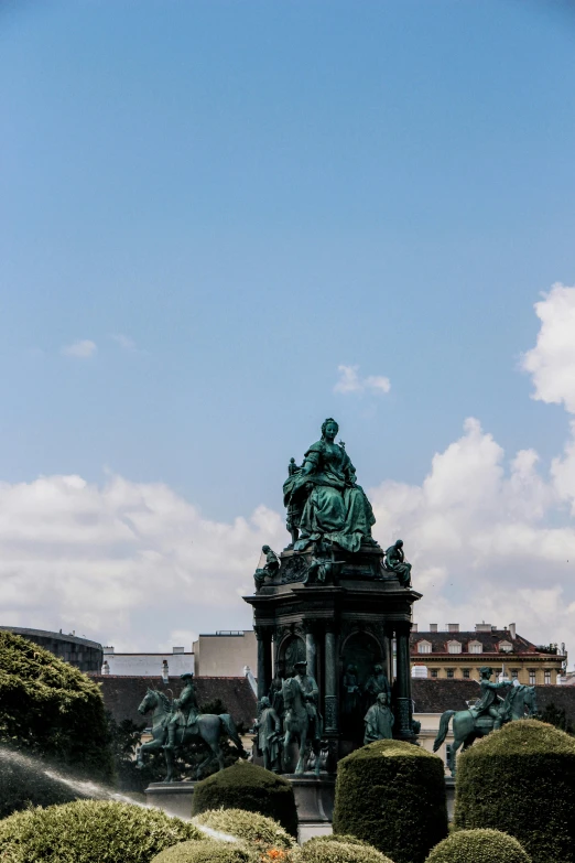 a statue sitting in the middle of a lush green park, inspired by Mihály Munkácsy, rococo, city views, fountain, blue sky, crowded square