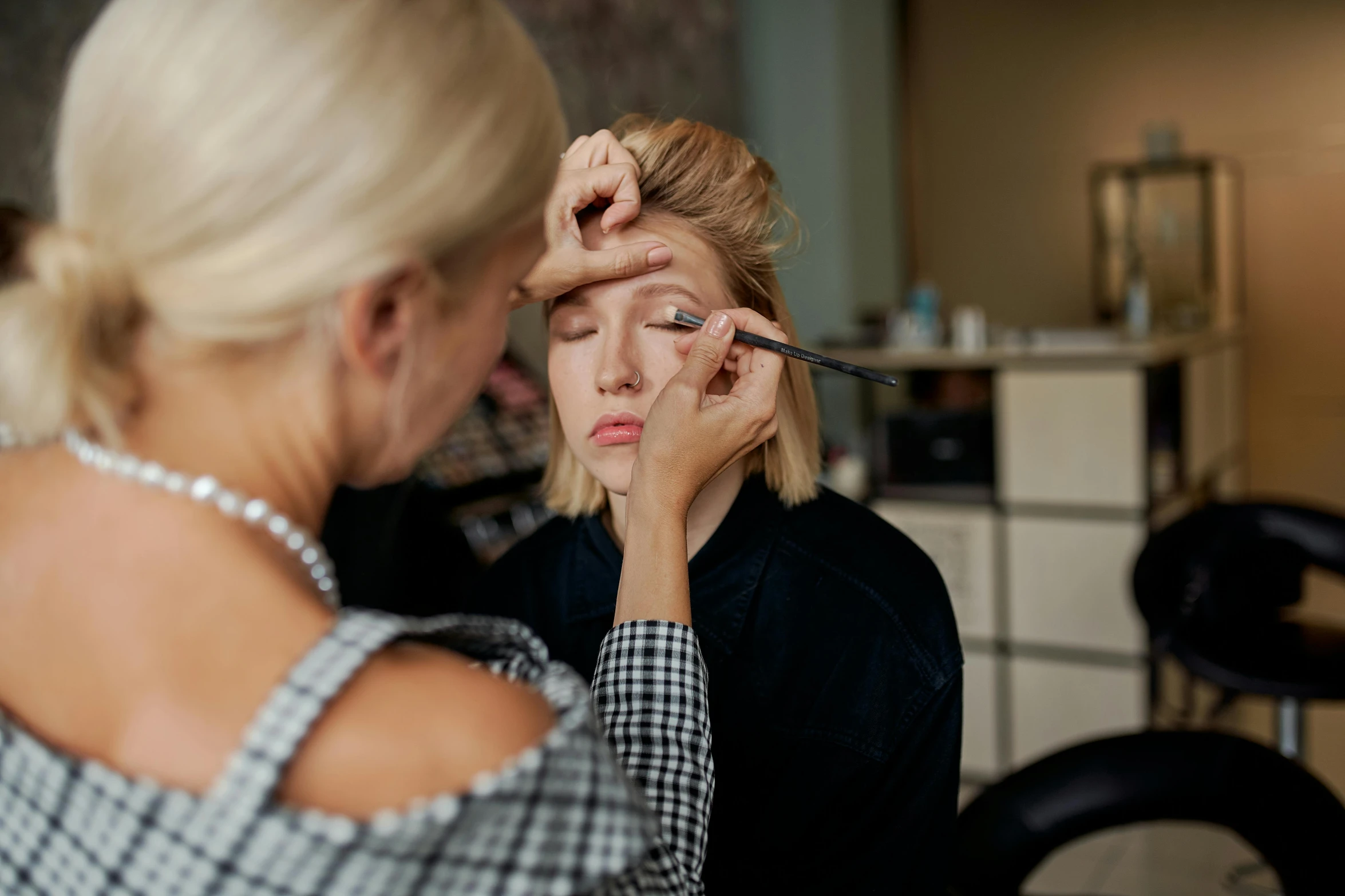 a woman is getting her make up done, by Julia Pishtar, nina tryggvadottir, professionally made, thumbnail, jeszika le vye