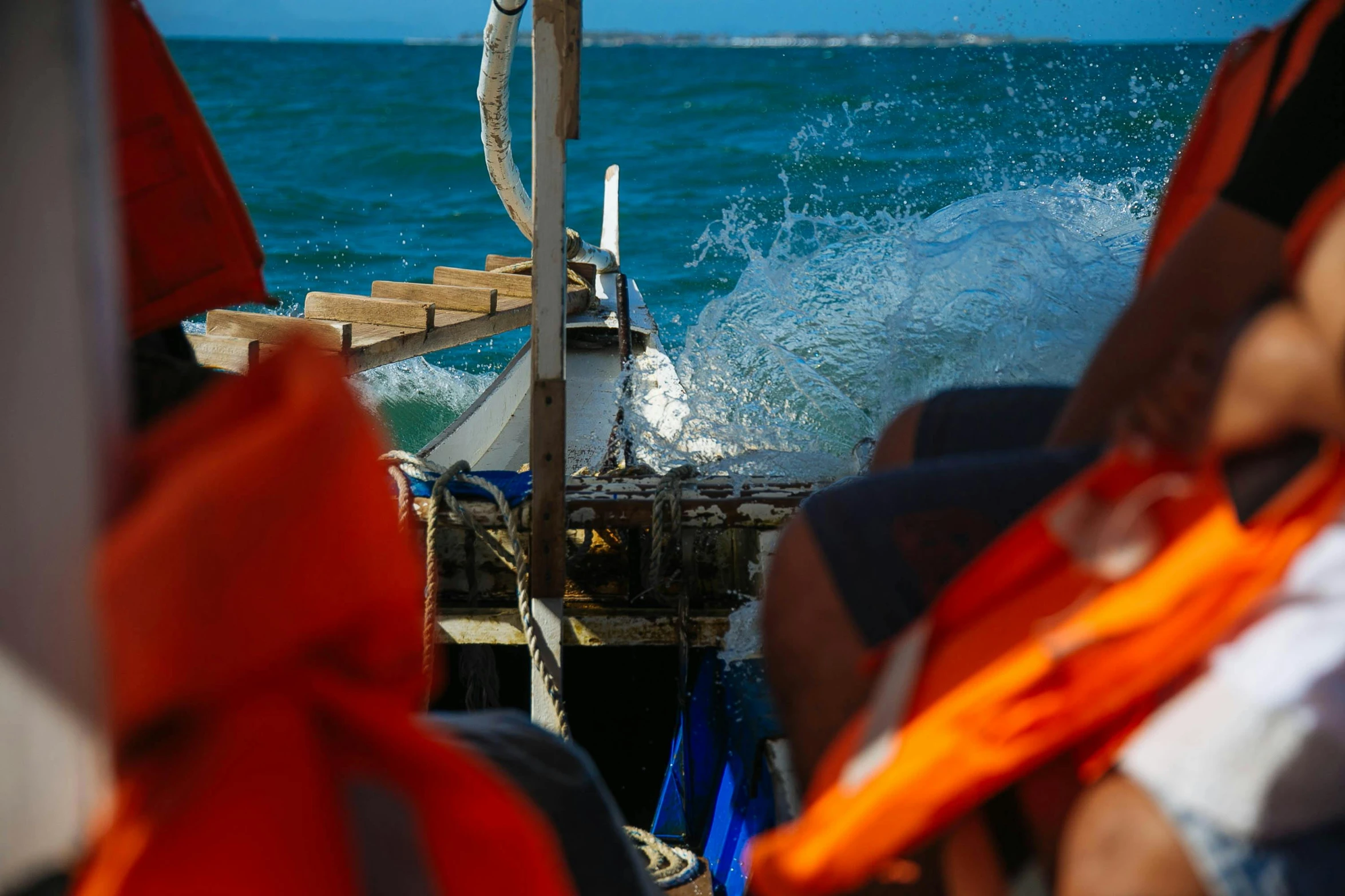 a group of people on a boat in the ocean, rough water, te pae, profile image, close - up photo