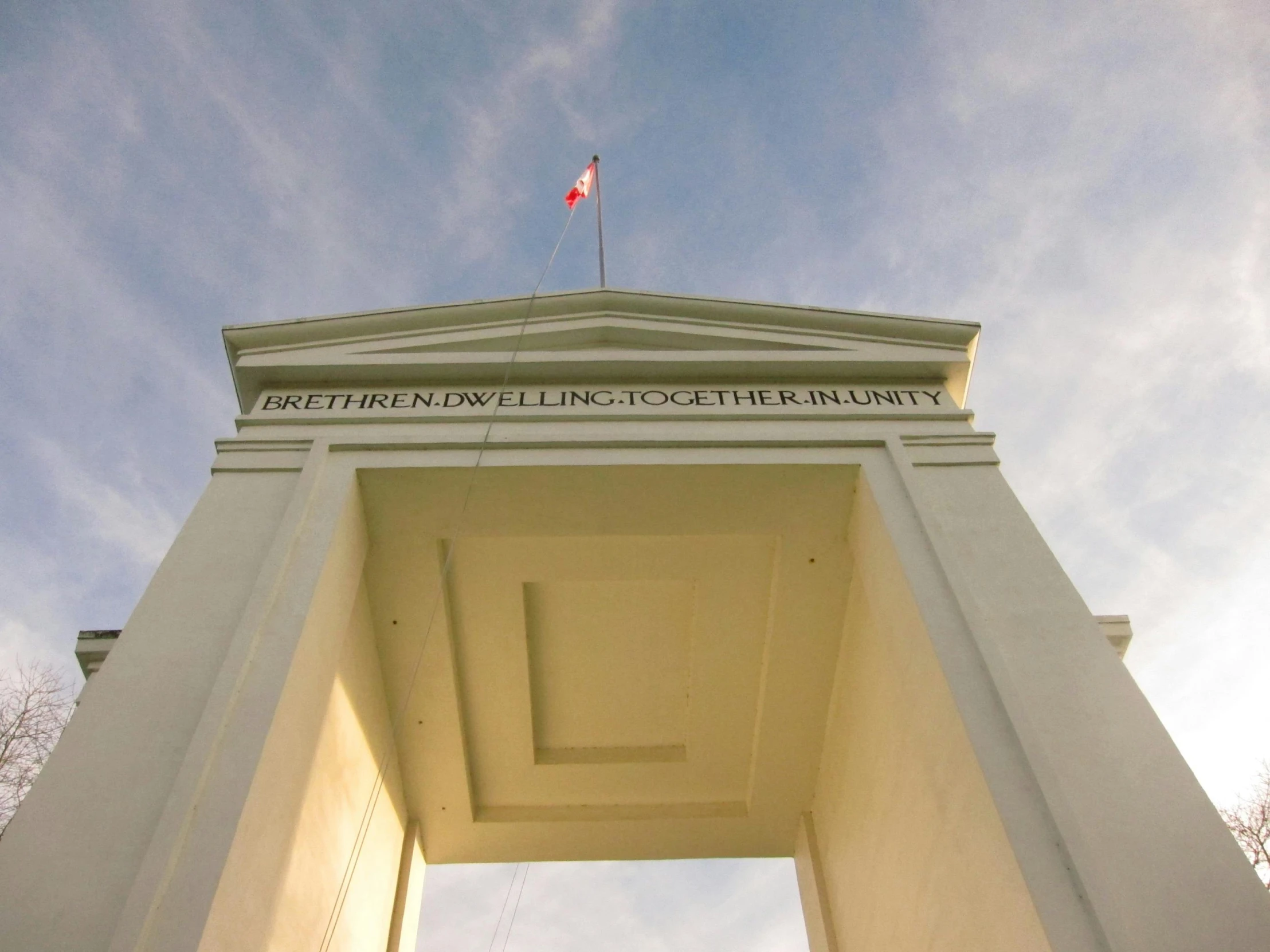 a building with a flag on top of it, inspired by Ian Hamilton Finlay, entrance to ethereal realm, jakarta, palladian, profile image