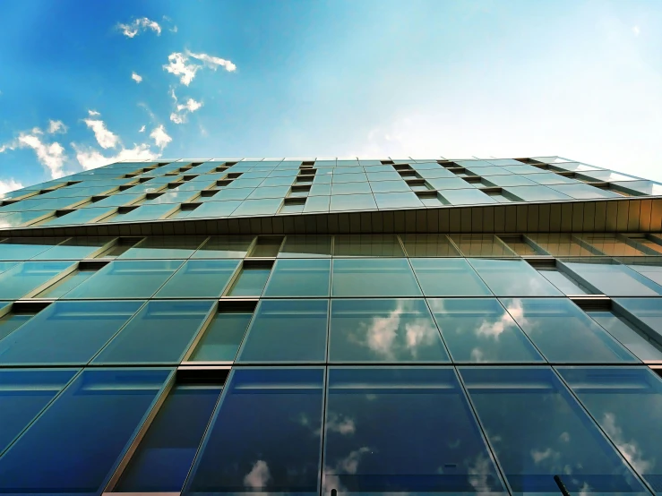 a very tall building with lots of windows, unsplash, bauhaus, big sky, octane render hdr, clear glass wall, perfect high resolution