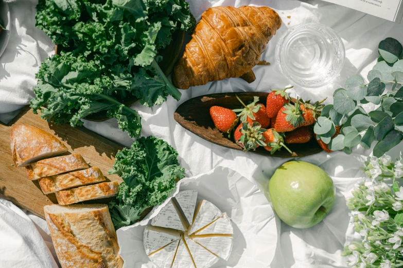 a close up of a plate of food on a table, fruits in a basket, having a picnic, sustainable materials, overview