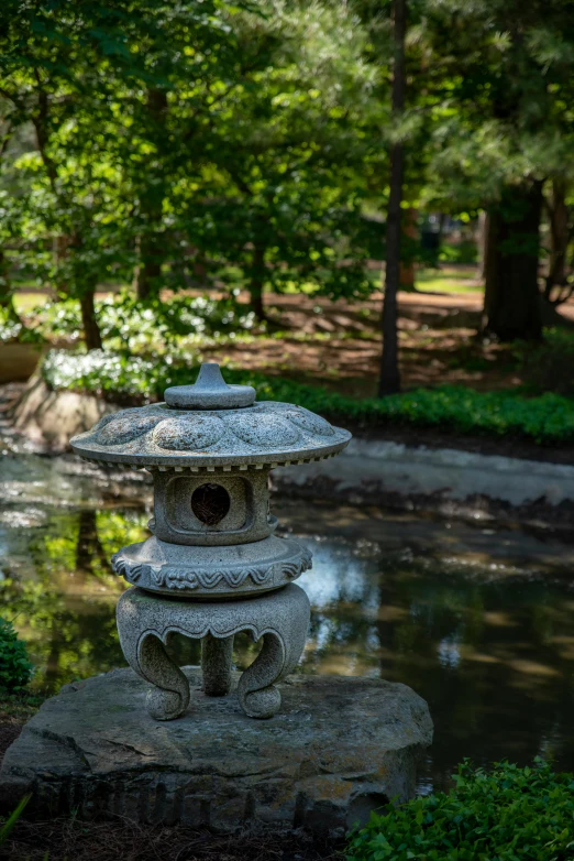 a stone lantern sits in the middle of a pond, visual art, sculpture gardens, 2019 trending photo, medium shot angle, porcelain