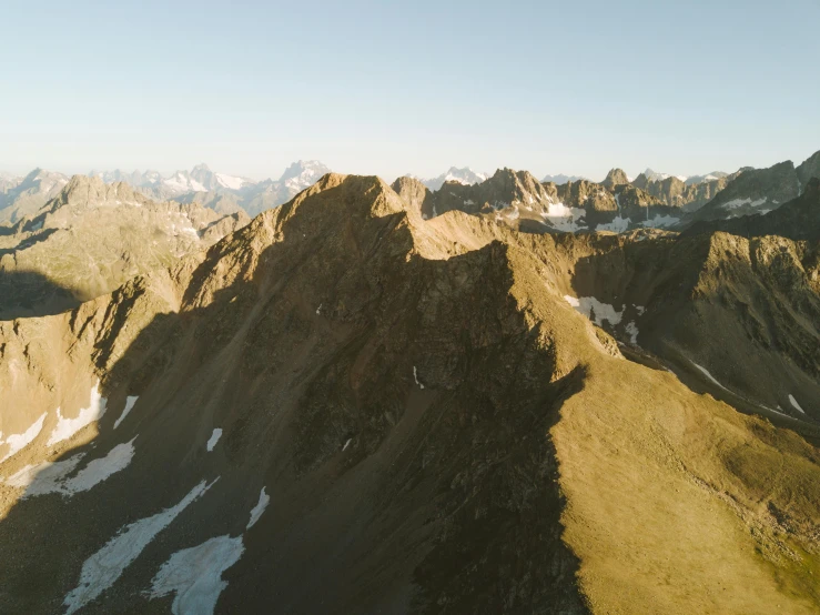 a group of people standing on top of a mountain, pexels contest winner, les nabis, “ aerial view of a mountain, hq 8k cinematic, high resolution ultradetailed, sunlit