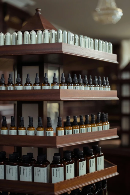 a bunch of bottles that are on a shelf, brown robes, philosophy, manicured, exterior shot