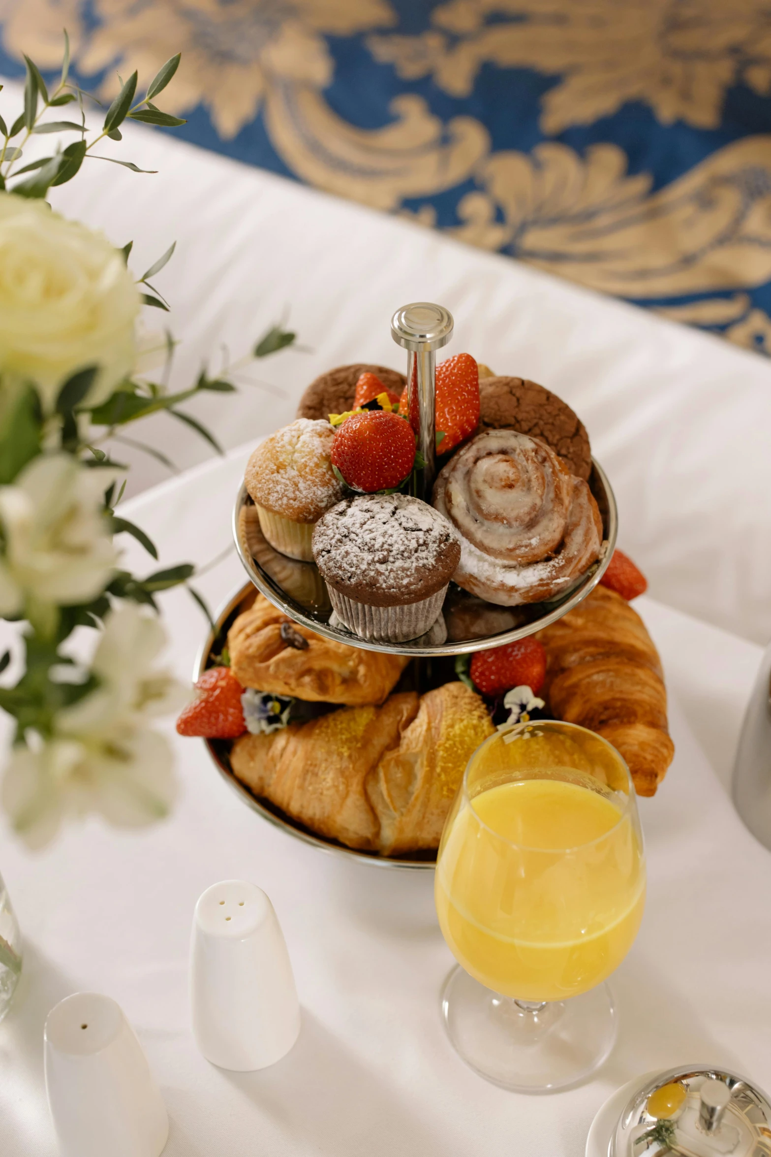 a close up of a plate of food on a table, hotel room, pastries, bouquets, lots de details