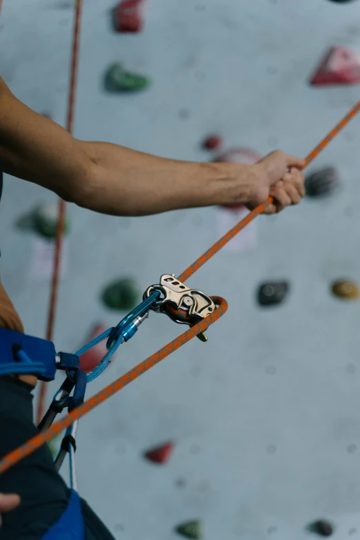 a close up of a person on a climbing wall, profile image, belaying, grey