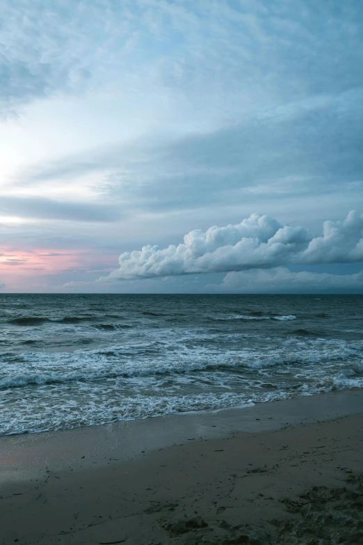 a man flying a kite on top of a sandy beach, inspired by Georg Friedrich Schmidt, unsplash, renaissance, layered stratocumulus clouds, humid evening, sri lankan landscape, today\'s featured photograph 4k