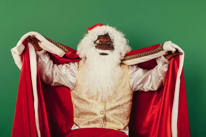 a man dressed as santa claus sitting on a chair, an album cover, pexels contest winner, hurufiyya, kehinde wiley, old wizard robe, thumbnail, no watermarks