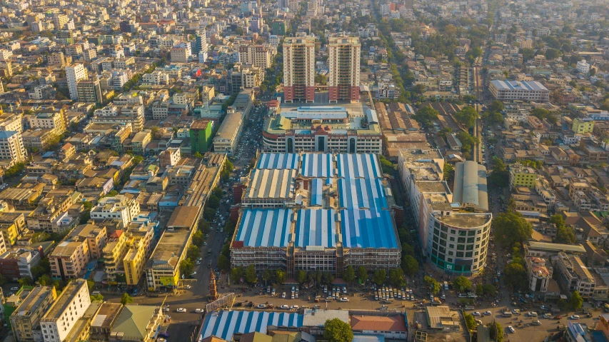 an aerial view of a city with lots of buildings, pexels contest winner, bengal school of art, herzog de meuron, trading depots, exterior shot, hi resolution