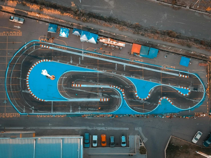 an aerial view of a race track in a parking lot, reddit, blue orange, shot with hasselblade camera, square, formulae