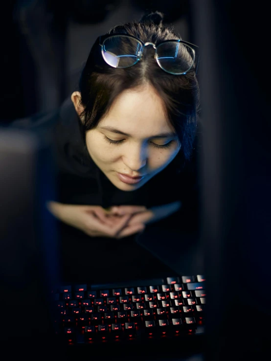 a woman sitting in front of a computer keyboard, nvidia rtx reflections, cgsociety portrait, high angle closeup portrait, siggraph