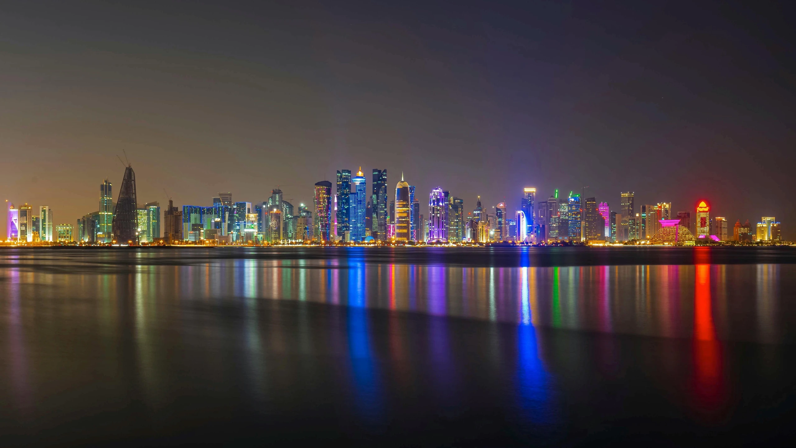 a large body of water with a city in the background, by Jan Rustem, pexels contest winner, arabian night, a colorful, panoramic, snapchat photo