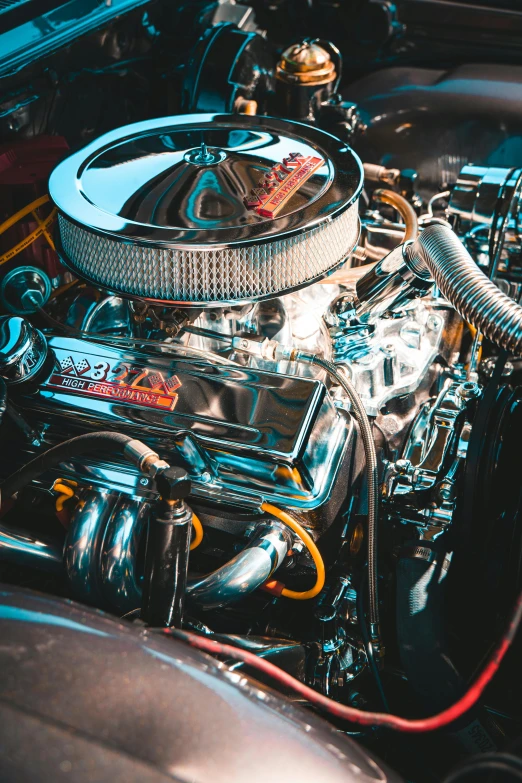 a close up of an engine in a car, pexels contest winner, flat shaped chrome relief, muscle cars, chromatic, aftermarket parts