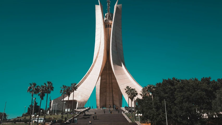 a very tall building sitting in the middle of a park, a colorized photo, pexels contest winner, modernism, moorish architecture, oscar niemeyer, holy place, from egypt