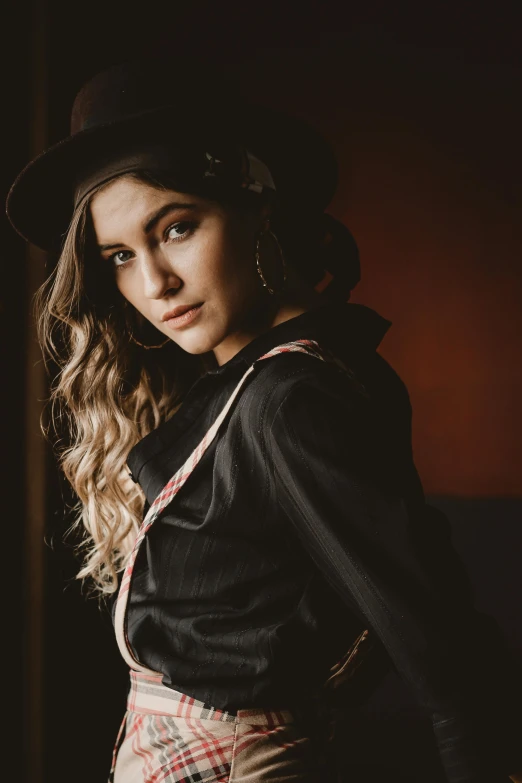 a woman standing in front of a window wearing a hat, a portrait, trending on pexels, wearing a fancy black jacket, oldwest, beautiful girl, portrait of morana