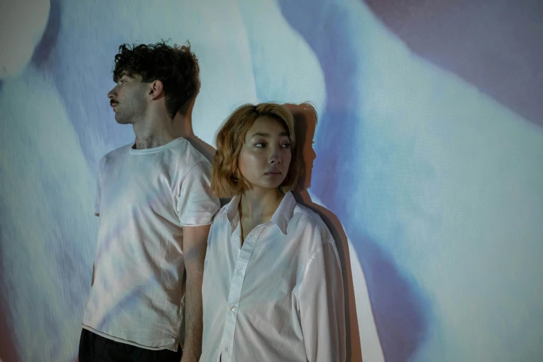 a man and a woman standing next to each other, an album cover, pexels contest winner, wearing a light shirt, teamlab, imogen poots d&d paladin, fiona staples and kinu nishimura