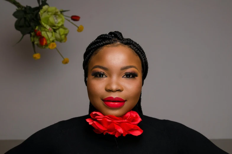 a woman with a red flower in her hair, an album cover, by Chinwe Chukwuogo-Roy, pexels contest winner, hurufiyya, thick red lips, ceo, wearing intricate black choker, professional photo-n 3