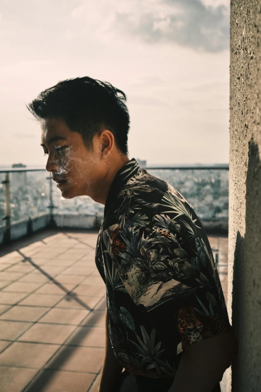 a man standing on top of a roof next to a building, a picture, inspired by Joong Keun Lee, pexels contest winner, hyperrealism, markings on his face, wearing a fancy jacket, wearing camo, profile pic