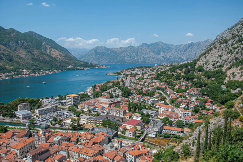 the town of kotor with mountains in the background, by Julia Pishtar, pexels contest winner, square, thumbnail, high view, sunny day