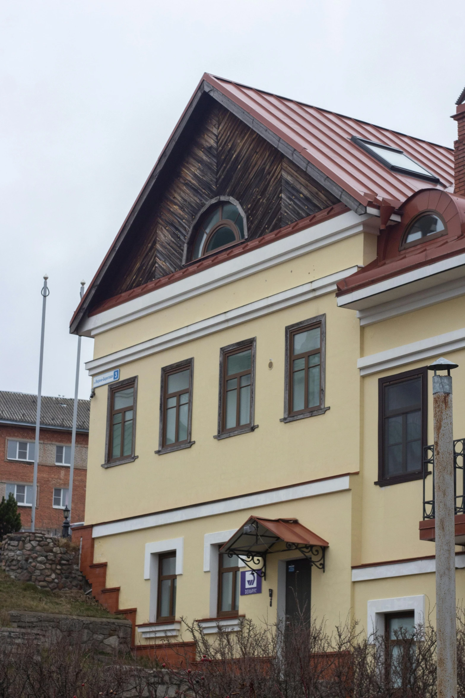 a large yellow building with a red roof, inspired by Otakar Sedloň, slate, shot from roofline, kuzma petrov - vodkin, tula