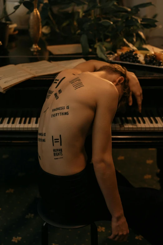 a man sitting on a stool next to a piano, an album cover, by Anna Füssli, trending on pexels, antipodeans, cracked body full of scars, cai xukun, concept photoset, body parts