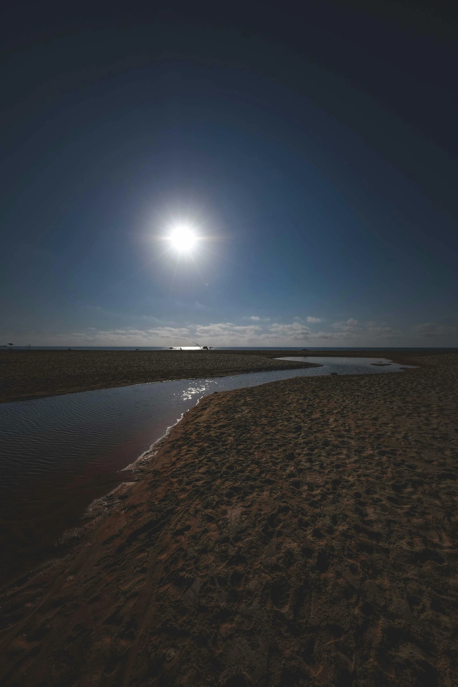 a large body of water sitting on top of a sandy beach, by Eglon van der Neer, with the moon out, the sun is shining. photographic, night time australian outback, slide show