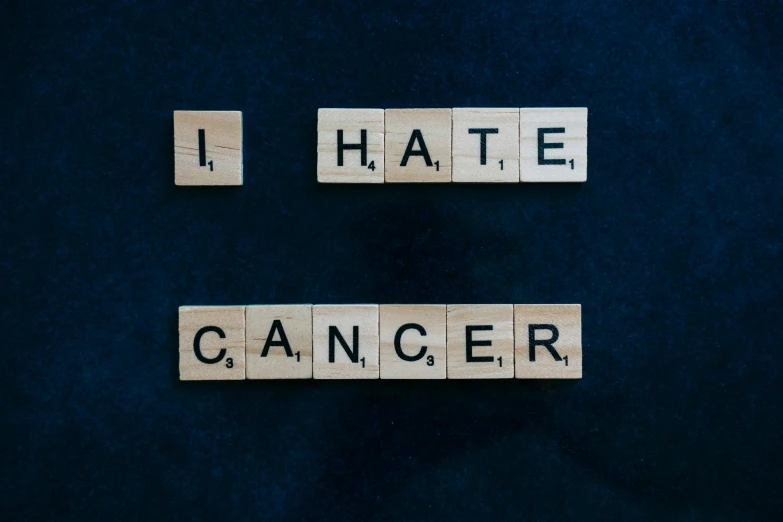 scrabbles spelling i hate cancer on a blue background, trending on unsplash, avatar image, on black background, vintage photo, 1 2 9 7