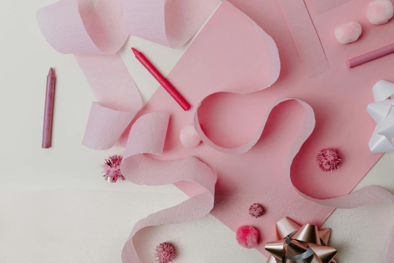 craft supplies laid out on a pink surface, by Helen Stevenson, trending on pexels, kirigami, ribbon, holiday, animation still