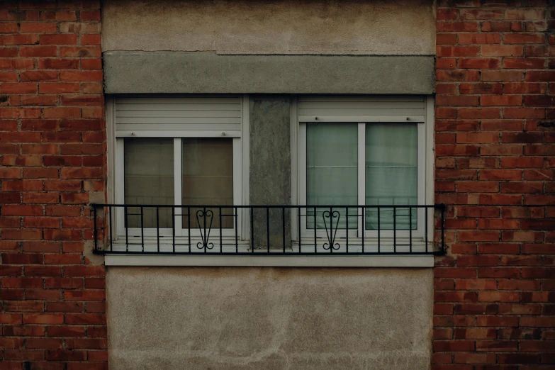 a red fire hydrant sitting in front of a brick building, inspired by Elsa Bleda, unsplash, postminimalism, house windows, alessio albi, gray concrete, two - tone