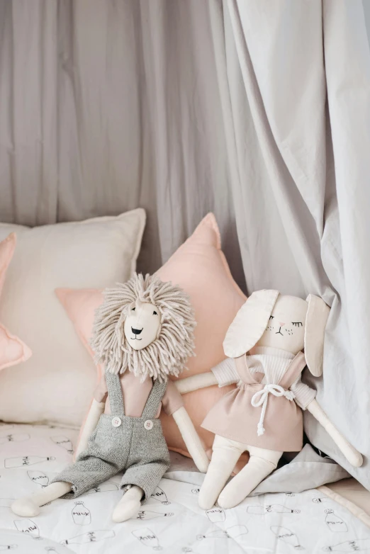 a couple of stuffed animals sitting on top of a bed, inspired by Maurice Sendak, featured on pinterest, baroque, pink and grey muted colors, softplay, tiny stars, detail shot