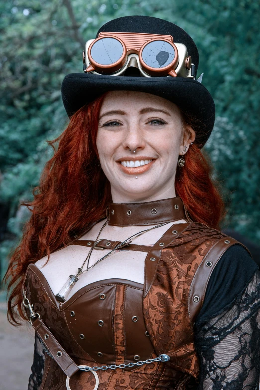 a woman with red hair wearing a top hat and goggles, reddit, <wearing brown leather armor>, smiling, photograph taken in 2 0 2 0, california;