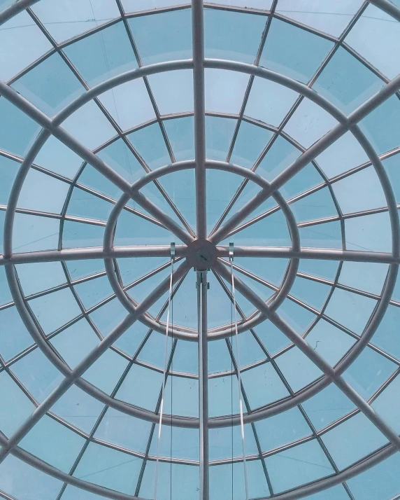 a close up of a metal structure with a blue sky in the background, inside a dome, ceiling to floor windows, profile image, transparent