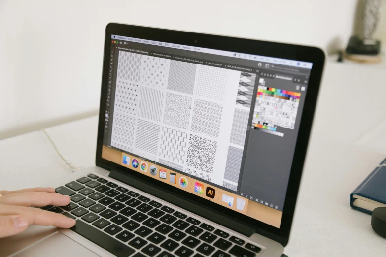 a person using a laptop computer on a desk, behance, repeating patterns, print!, accurately detailed, typographic