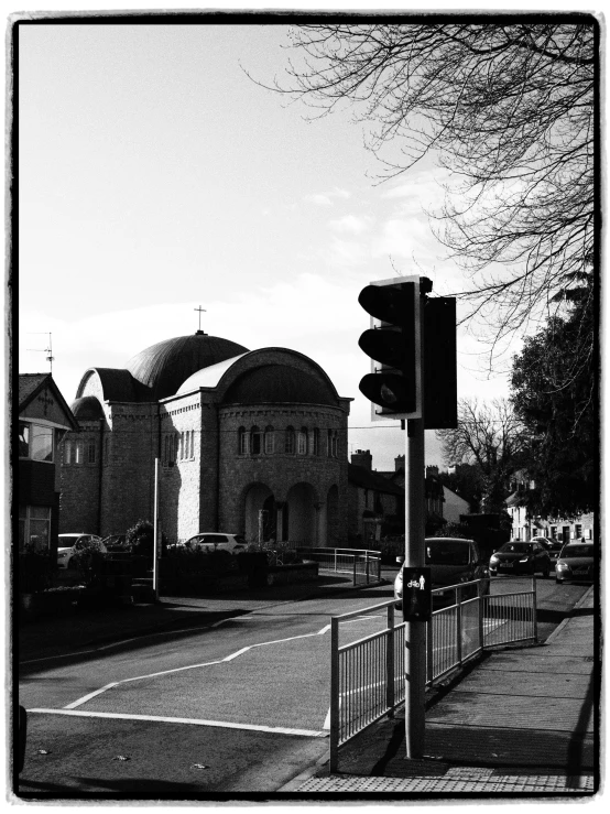 a black and white photo of a street corner, by Steve Prescott, with great domes and arches, mayfield parish, traffic light, orthodox