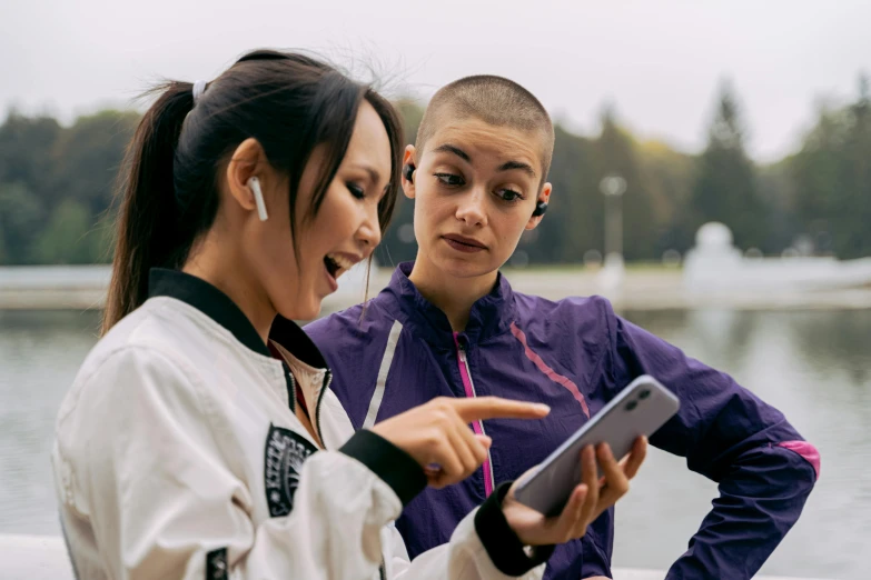 a couple of women standing next to each other, trending on pexels, happening, wearing track and field suit, integrating with technology, avatar image, chinese