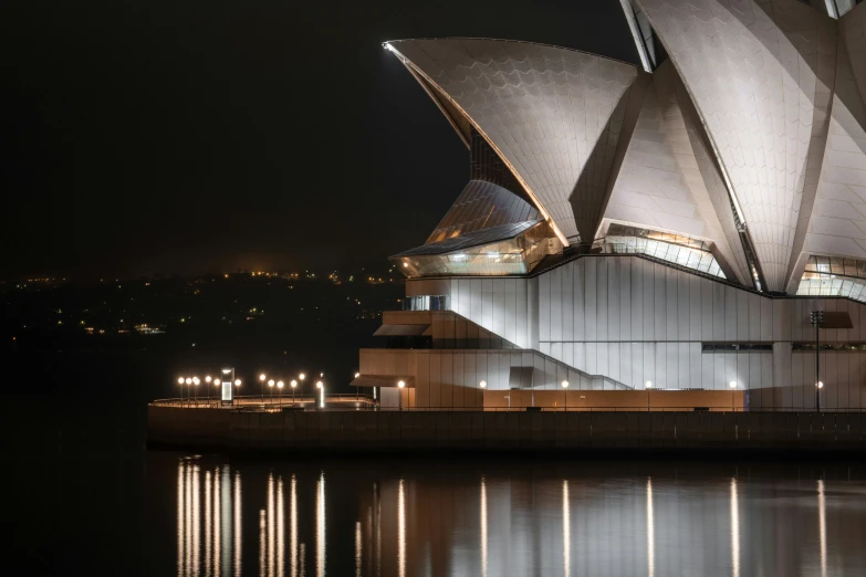 the sydney opera house lit up at night, pexels contest winner, modernism, seen from the side, photography hyperrealism, minimalist, harbour